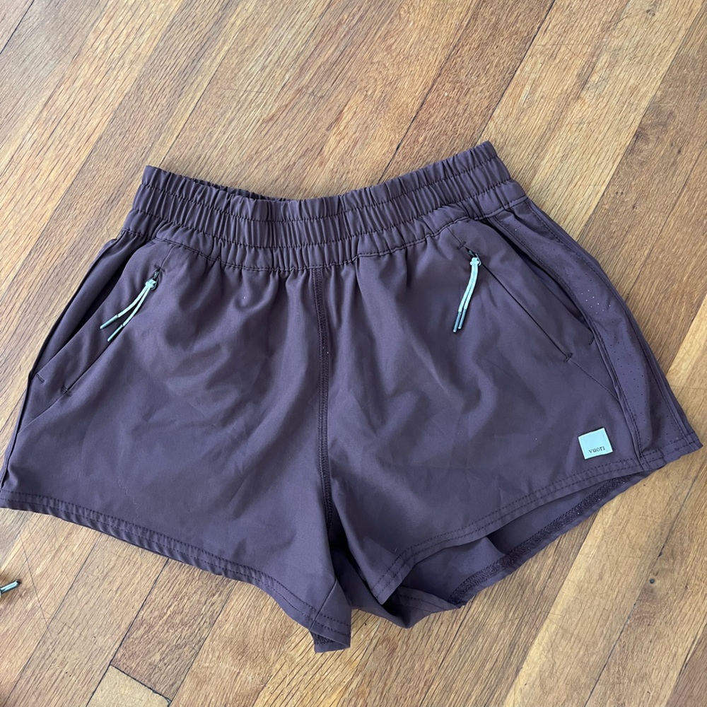 Vuori purple Maeve Running Shorts with Mint Zip Accents